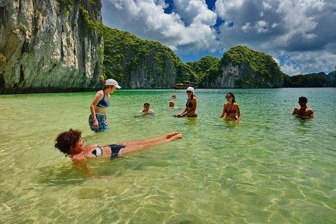 1 Day Boat Tour: HaLong Bay, Lan Ha Bay, Natural Beach and Full Moon Party - Swimming from the boat and reaching a natural beach