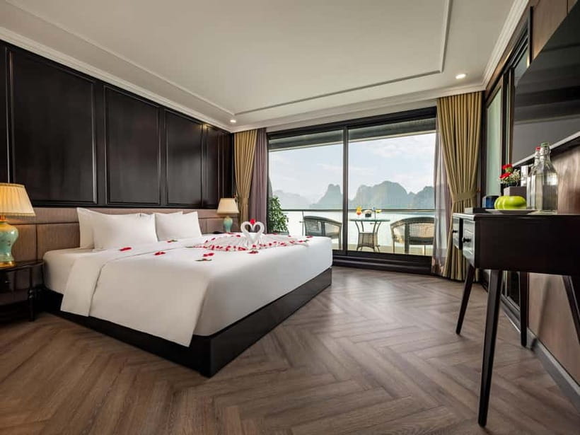 2-Day or 3-Day: Halong&Lan Ha Bay Cruise 5<em> balcony,bathtub – Key points at a glance’ /></p>
<ul>
<li><strong>A private balcony and bathtub:</strong> Cabins offer more space and privacy than a basic overnight boat.</li>
<li><strong>The 3-day route adds Viet Hai Village:</strong> Ride a bicycle or electric car, then visit a local home.</li>
<li><strong>Dark and Bright Cave is the final highlight:</strong> Choose a kayak or a bamboo boat rowed by local boatmen.</li>
<li><strong>Daily activities are easy to join:</strong> Kayaking, swimming, cooking, sunset drinks, Tai Chi, and squid fishing are included.</li>
<li><strong>Transport takes time:</strong> The ride from Hanoi lasts about three hours, followed by a transfer boat to the cruise.</li>
<li><strong>Food is the main uncertainty:</strong> Seafood and barbecue are served, but meal quality has not been consistent.</li>
</ul>
<h2 id="what-the-doria-cruise-does-well">What the Doria Cruise does well</h2>
<p><img width="487" height="650" decoding="async" src=