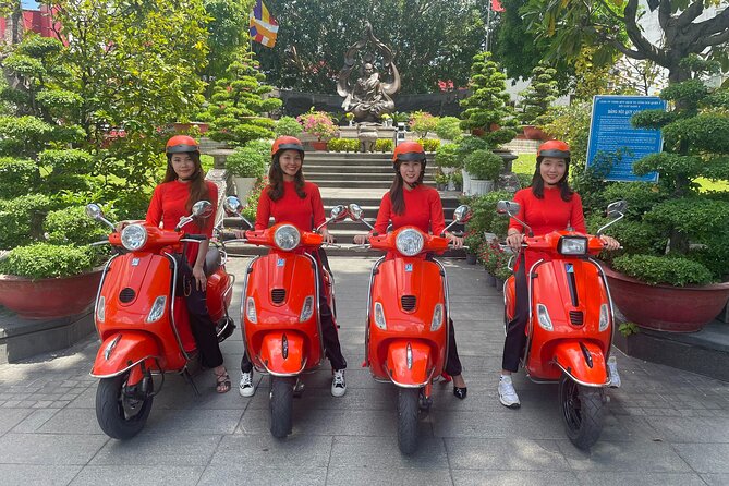 Beautiful Female Riders Vespa Red River Countryside Tour 5 Hours - Leaving Hanoi across Long Bien Bridge