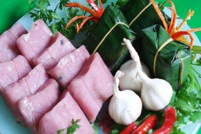 DaNang Night Foodie Tour-Sighseeing with Aodai Lady Rider Private - Starting with cakes wrapped in banana leaves