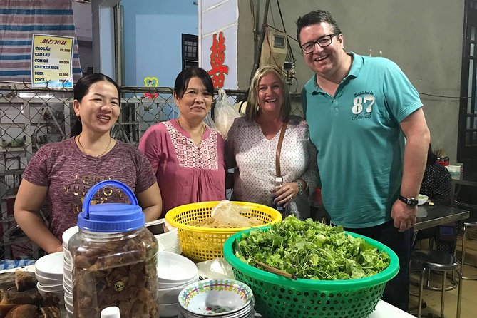 Evening Walking Food Tour, folk game and lantern boat - The first food stops: banh mi and white rose dumplings