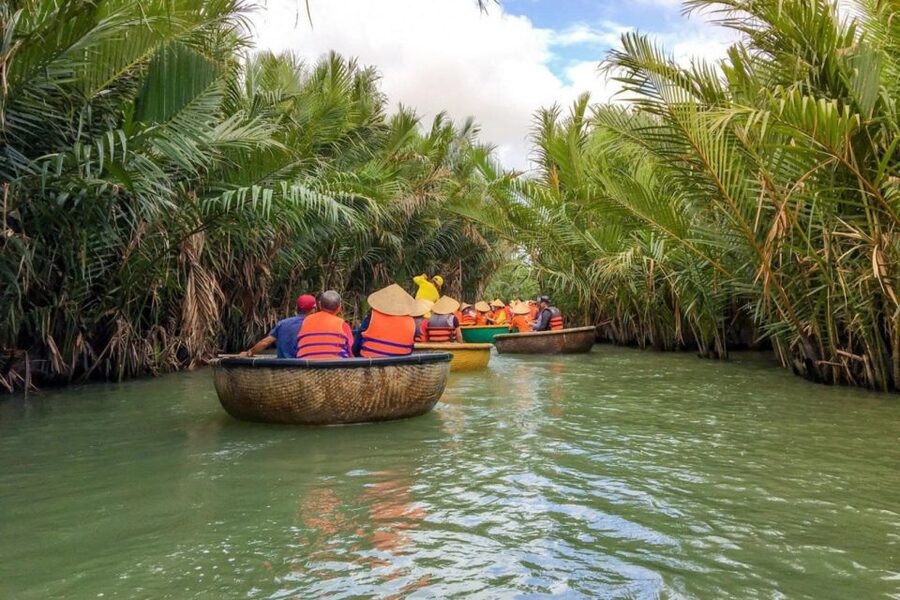 Experience Bamboo Basket Boat on Coconut village w Locals - The conical hat is more than a photo prop