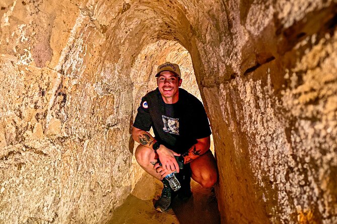 Explore Cu Chi Tunnels & Saigon History 1 Day Tour - Cu Chi Tunnels: traps, tanks, and a tight passage
