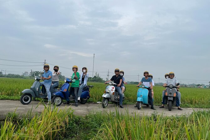 Exploring Vespa Tour Through Little Red River Delta - From Hanoi landmarks to open rice fields