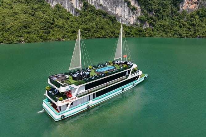 From Hanoi: 1-Day Halong 5-Star Cruises with Big & Small Groups - Sundeck views, tea, and traditional music