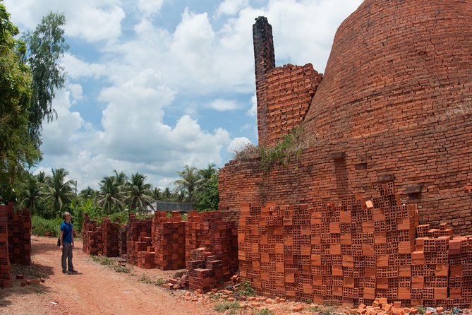 From HCM city: Private Mekong Delta - Ben Tre Full-Day Tour - Walking through a village and watching mats take shape