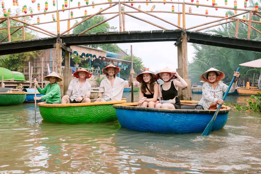 From Hoi An: Market Tour, Basket Boat Ride and Cooking Class - A round boat through the water coconut palms