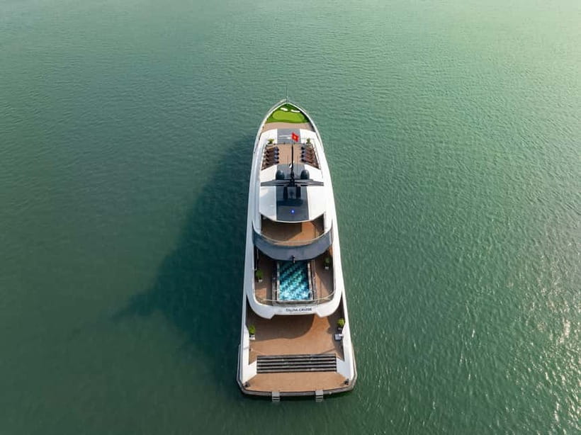 Full Day: Fabulous Halong Bay Tour with Taliya Cruise 5<em> – Key points to know before booking’ /></p>
<ul>
<li><strong>Dark and Bright Cave is visited by bamboo boat:</strong> A local rower takes you through a calm cave and into a hidden lagoon, so you do not need to paddle this section yourself.</li>
<li><strong>Ao Ech includes swimming:</strong> This is a useful feature if you want time in the water, since some Halong Bay cruises do not allow swimming.</li>
<li><strong>The boat route reaches both Halong Bay and Lan Ha Bay:</strong> You get famous scenery plus a quieter area with roughly 400 islands and limestone formations.</li>
<li><strong>The day includes more than sightseeing:</strong> Lunch, afternoon tea, a spring-roll demonstration, a sunset gathering, and an outdoor Jacuzzi are part of the cruise experience.</li>
<li><strong>Transport makes or breaks the value:</strong> Hotel pickup and return are available from Hanoi’s Old Quarter, but the road day is long and the shuttle may feel tight.</li>
<li><strong>The $57 price is strong for a full day:</strong> It covers the cruise, lunch, guide, entrance fees, bamboo boat, kayaking, swimming, and return transport if that option is selected.</li>
</ul>
<h2 id="a-seven-hour-cruise-through-two-famous-bays">A seven-hour cruise through two famous bays</h2>
<p><img width="820" height="614" decoding="async" src=