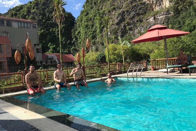 Full-Day Tour Hoa Lu, Tam Coc Boat Trip and Mua Cave - Cycling through a Ninh Binh village