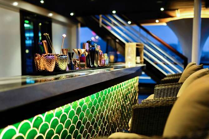 Halong Bay Luxury Dinner Cruise - Ambassador - Sailing beside Ha Long City after dark