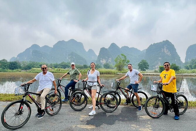 Hang Mua - Hoa Lu - Tam Coc Small Group Tour 8 People a Group - Cycling beside Ninh Binh’s rice fields