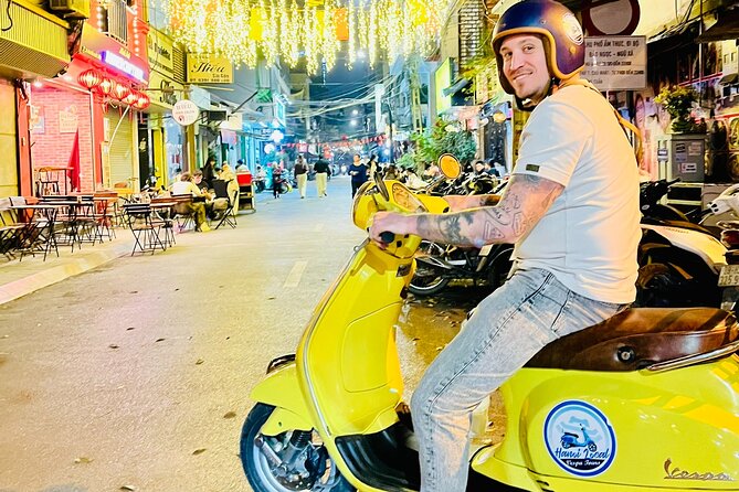 Hanoi After Dark Vespa Tour (4 hours): Street Food & Night Vibes - Hoan Kiem starts the evening at street level