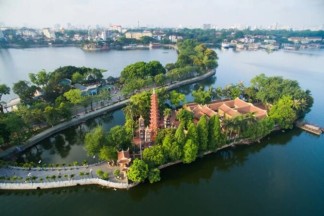 Hanoi All in One Full Day Sightseeing Tour - Seeing a train pass through Hanoi’s narrow street