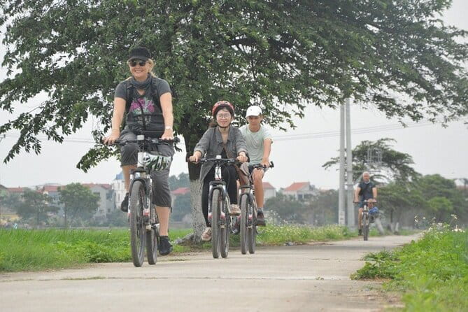 Hanoi Countryside By Bike & Local House and Food Tasting - Leaving Hanoi by bicycle across Long Bien Bridge