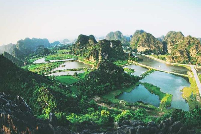 Hanoi - Hoa Lu - Tam Coc - Mua Cave - 1 Day Tour. By Luxury Limousine From Hanoi - Climbing Mua Cave for the Tam Coc view