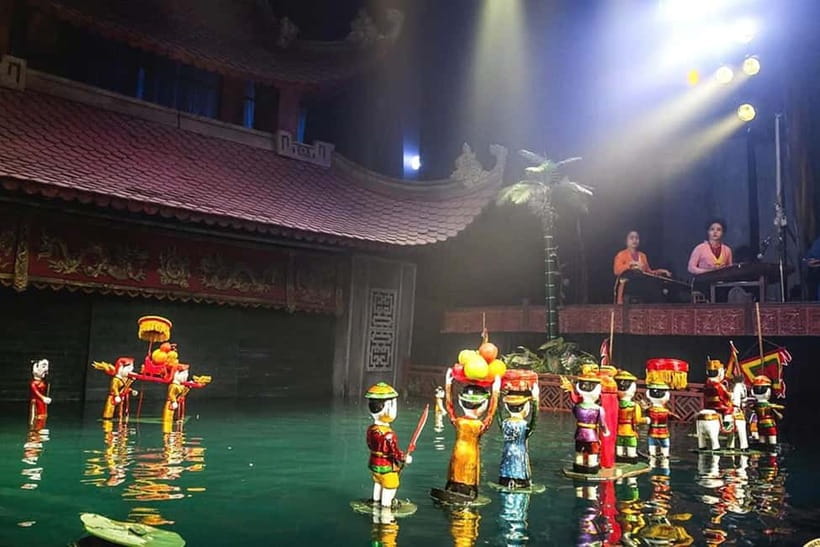 Hanoi: Thang Long Water Puppet Show Ticket - Skip The Line - Collecting the ticket on Hang Quat Street