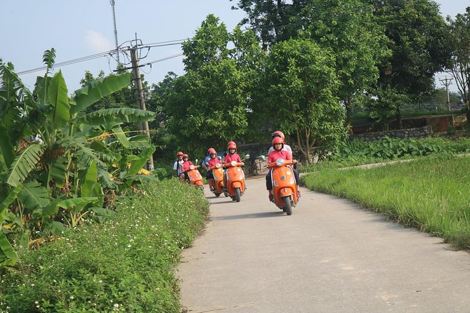 Hanoi Vespa Full Day City & Countryside with Female Ao Dai Riders - West Lake, botanical gardens, and the B52 site