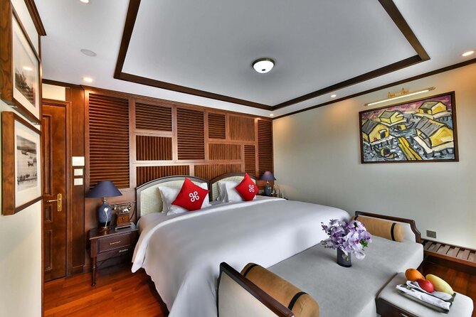 Heritage Cruises Best Luxury Cruise to Halong and Lan Ha Bay 2D1N - Evening views, cooking, music, and squid fishing