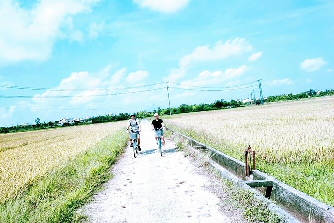 Hoi An countryside cycling tour - Changing bicycles for a Bay Mau basket boat