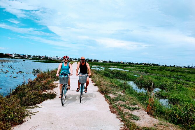 Hoi An countryside cycling tour - Working the gardens at Tra Que Vegetable Village