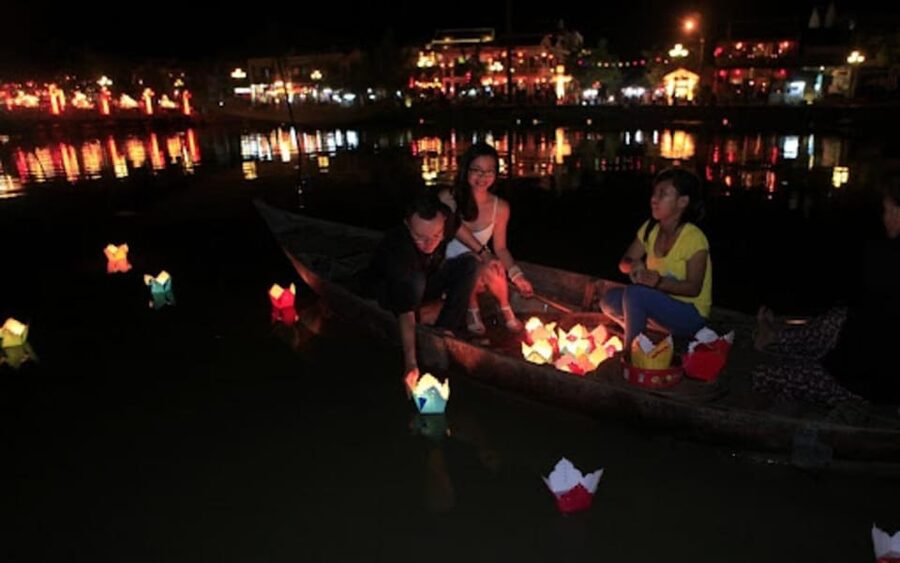 Hoi An: Hoai River Night Boat Trip and Floating Lantern - Boarding a four-person wooden boat