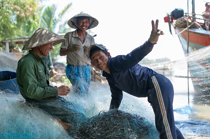Hoi An Morning Countryside Tour by Bike - Pedaling out through Hoi An’s historic center