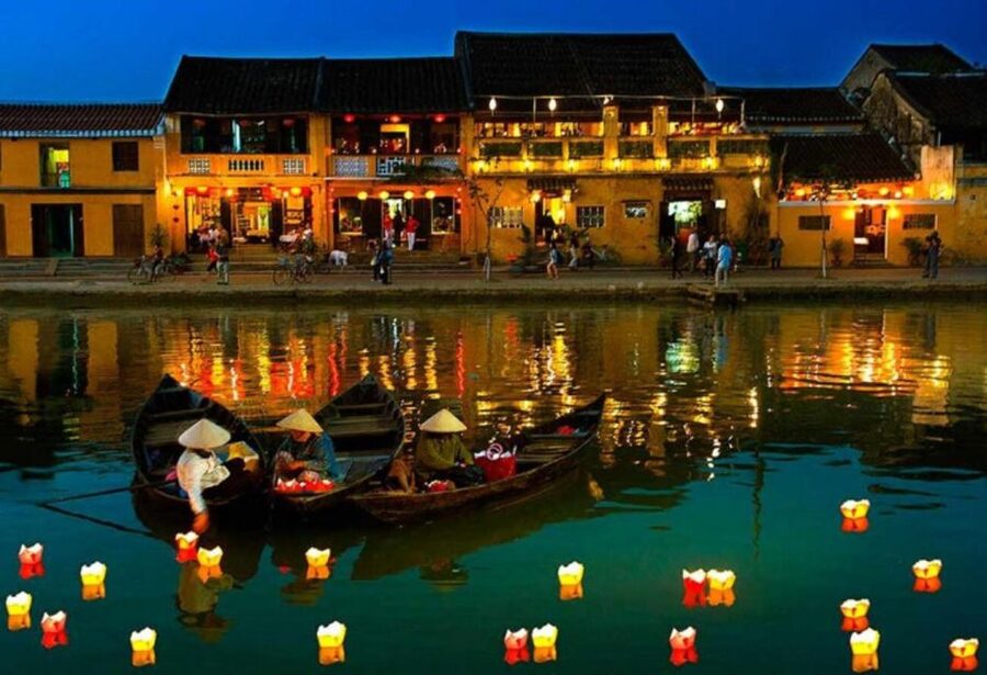 Hoi An: Night Boat Trip and Release Lantern at Hoai River - Releasing a candlelit lantern on the river