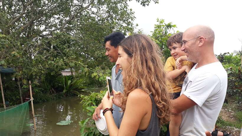 Mekong Day Tour by Car:Cai Be market, Local Island & Cycling - The hand-rowed sampan through narrow canals