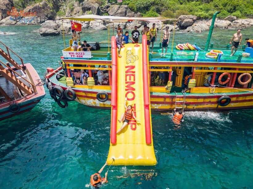 Nha Trang: Hopping Tour, Snorkeling, Boat Party, & BBQ Lunch - Music, wine, swimming, and the boat slide