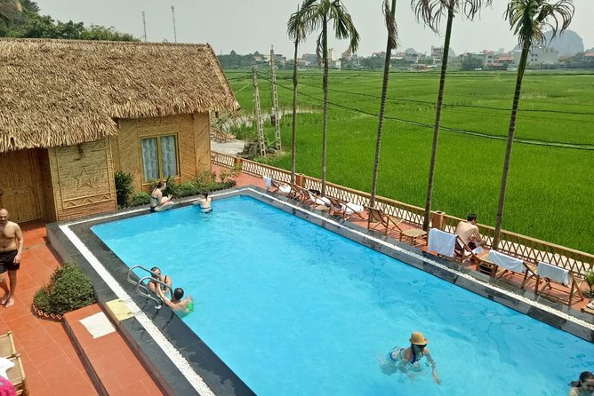 Ninh Binh Daily Tour: Hoa Lu -Mua Cave -Tam Coc- Bike-Swimming with Sunset Party - Swimming and the sunset fruit party