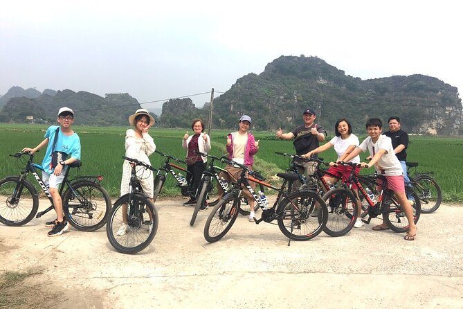 Ninh Binh Full-Day Small Group of 9 Guided Tour from Hanoi - Cycling beside rice fields and limestone peaks