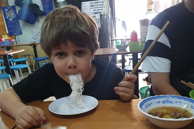 Private kid-friendly Hanoi food tour with a taste of great dishes - Passing Hoan Kiem Lake between food stops