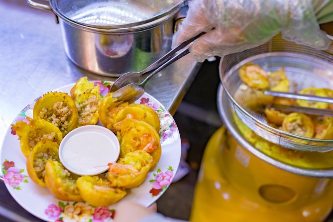 Private Street Food Evening Walking Tour in Ho Chi Minh City - First tastes: banh xeo and banh khot