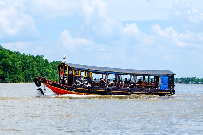 Small-Group Mekong Delta Day Trip: Boat Ride, Cottages & Pagoda - Gardens, canals, and the optional bicycle ride