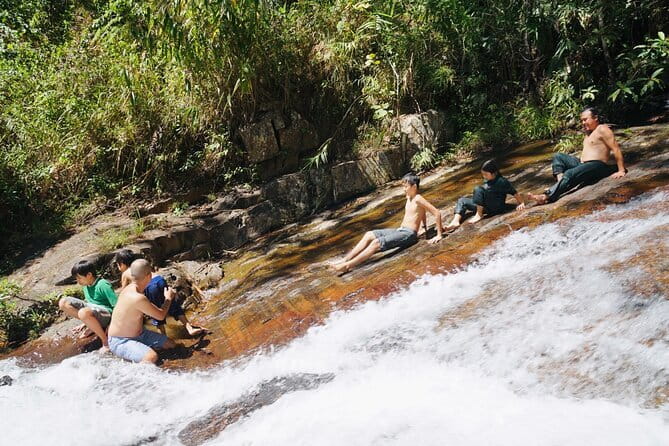 Trekking Tour to Hidden Waterfall & Sturgeon Farm for dog-lovers - Inside one of Da Lat’s large sturgeon farms